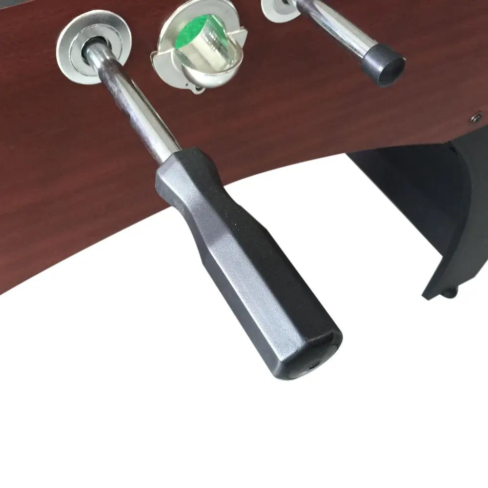  A close-up view of one of the handles and the ball-return chute on the Hathaway Metropolitan 54-inch Foosball Table.