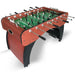A dynamic, three-quarter angle view of the Hathaway Metropolitan 54-inch Foosball Table, showcasing the complete look of the table, including its arched pedestal base and player rods.