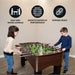 Two children playing on the Hathaway Primo foosball table, with labeled benefits: easy grip wood handles, smooth gameplay performance, and a durable build ideal for family fun.