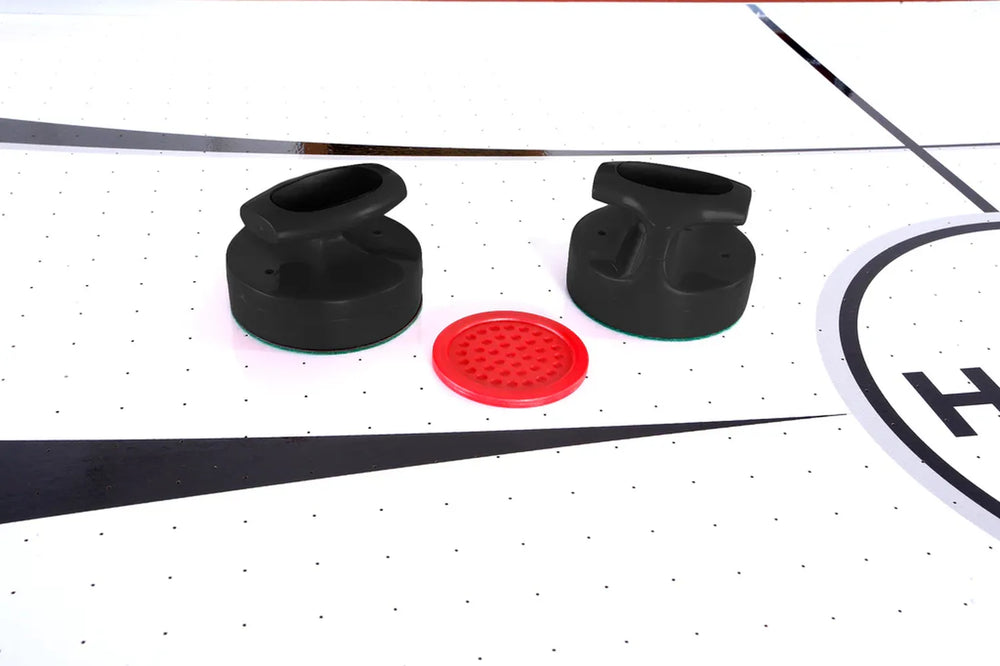 Hathaway Brentwood Air Hockey Table, close-up of playfield with black pushers and red puck.