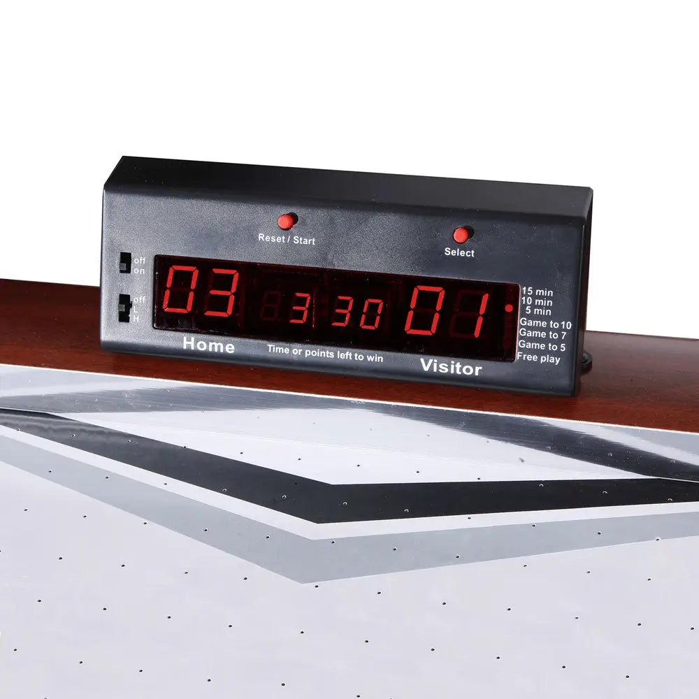 Close-up of Hathaway Midtown air hockey table LED scoring unit showing 3-to-1 score display, game mode buttons for 15-minute, 10-minute, and 5-minute timed play, and points-based settings