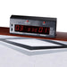 Close-up of the electronic LED scoreboard on an air hockey table displaying a score of 3 to 1. Includes red buttons for reset/start and select, with game mode options such as 15 min, 10 min, 5 min, and points-based play modes.