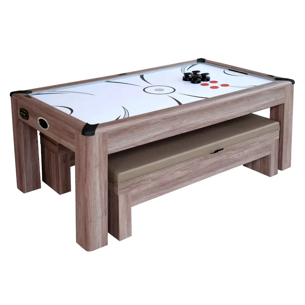 Rustic wood-style air hockey game table with visible play surface, benches stored underneath, and game accessories on top of table