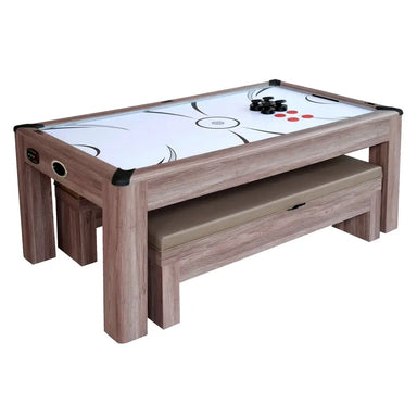 Rustic wood-style air hockey game table with visible play surface, benches stored underneath, and game accessories on top of table