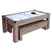 Rustic wood-style air hockey game table with visible play surface, benches stored underneath, and game accessories on top of table