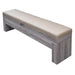 Individual cushioned bench with light wood finish and tan faux leather seat, designed to complement convertible game and dining tables.