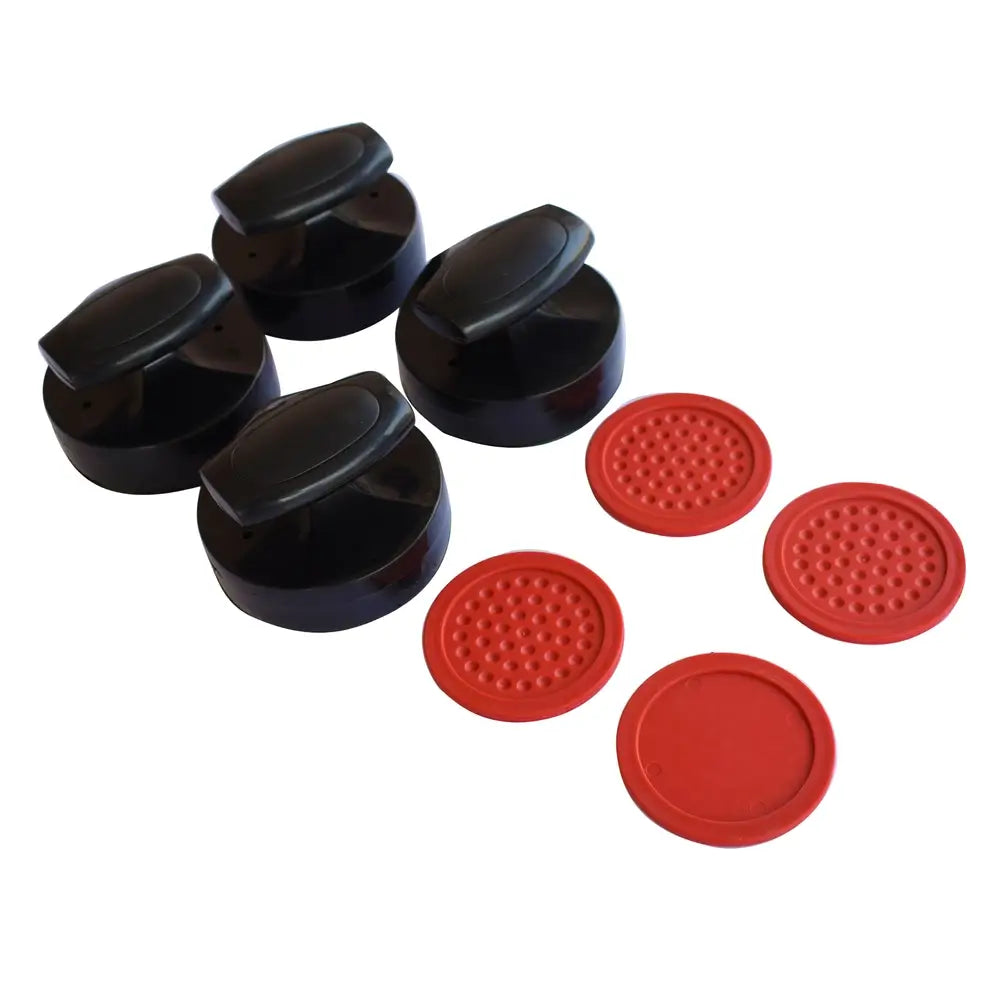 Set of four black air hockey strikers and four red pucks with textured surfaces, included accessories for air hockey table gameplay.