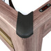Corner detail of wood-style air hockey table with black protective corner cap and built-in electronic scoreboard for home game rooms.