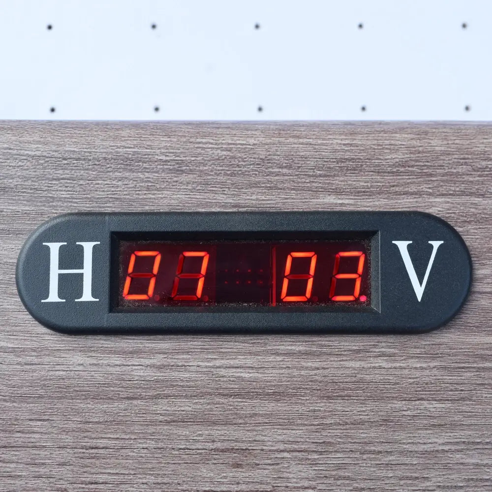 Electronic scoreboard display embedded in wood frame, showing scores for home and visitor teams with red LED digits.