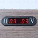 Electronic scoreboard display embedded in wood frame, showing scores for home and visitor teams with red LED digits.