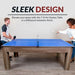 Modern 7-foot air hockey and ping pong table with driftwood melamine finish, shown in table tennis mode with two players enjoying a game.