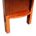 Close-up of lower leg shelf and curved wood detailing on Hathaway Merlot shuffleboard table in warm cherry wood finish.