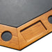 Close-up of Kingston poker table showing black faux leather surface with integrated wooden chip tray and drink holders in a honey oak finish.
