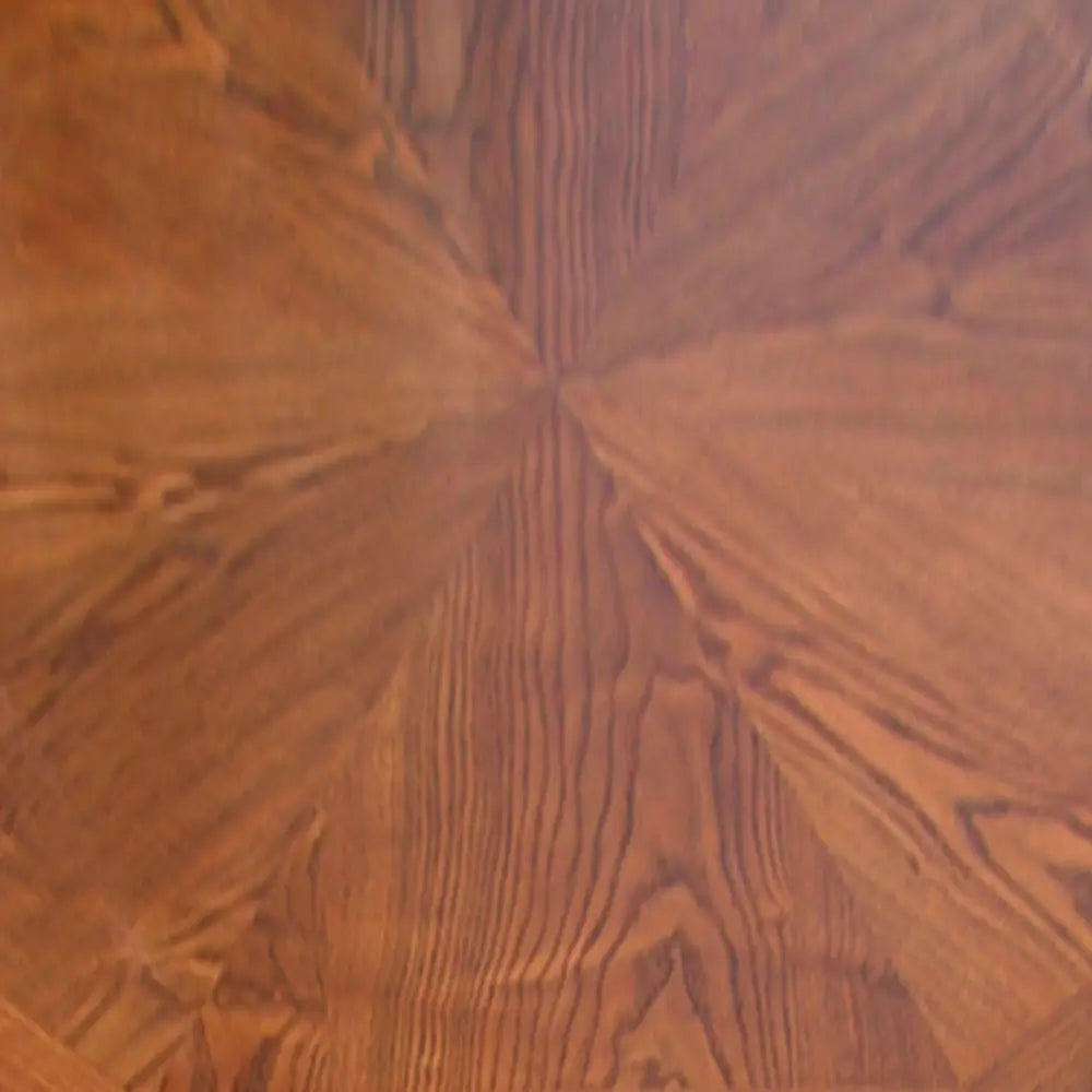 Close-up of Kingston game table wood veneer showing rich honey oak grain pattern with radial inlay design, ideal for elegant dining or gaming settings.