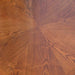 Close-up of Kingston game table wood veneer showing rich honey oak grain pattern with radial inlay design, ideal for elegant dining or gaming settings.