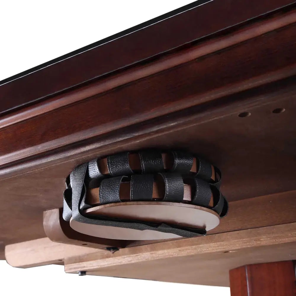 Underside view of Kingston game table showing drop-style leather net pocket for bumper pool ball return, integrated into solid wood frame.