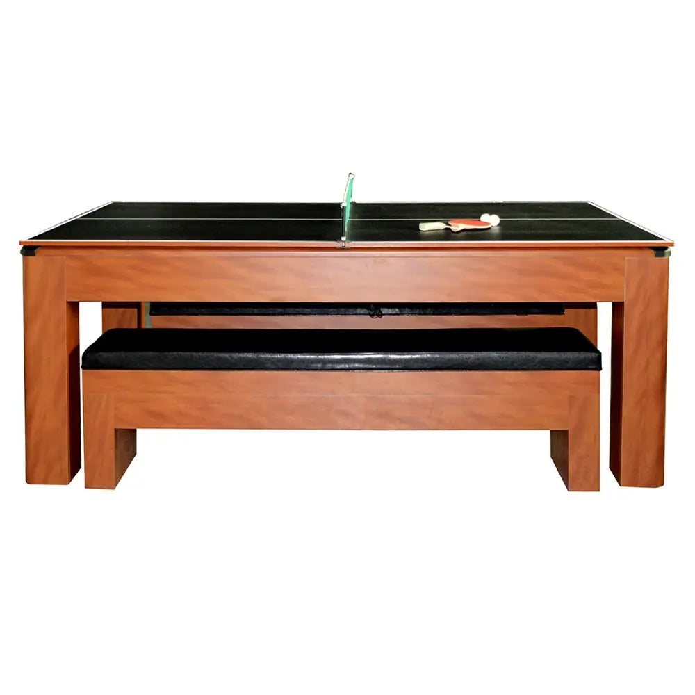 Convertible multi-game table in wood finish with black tabletop for ping pong, built-in bench seating, and included paddles and balls on surface.