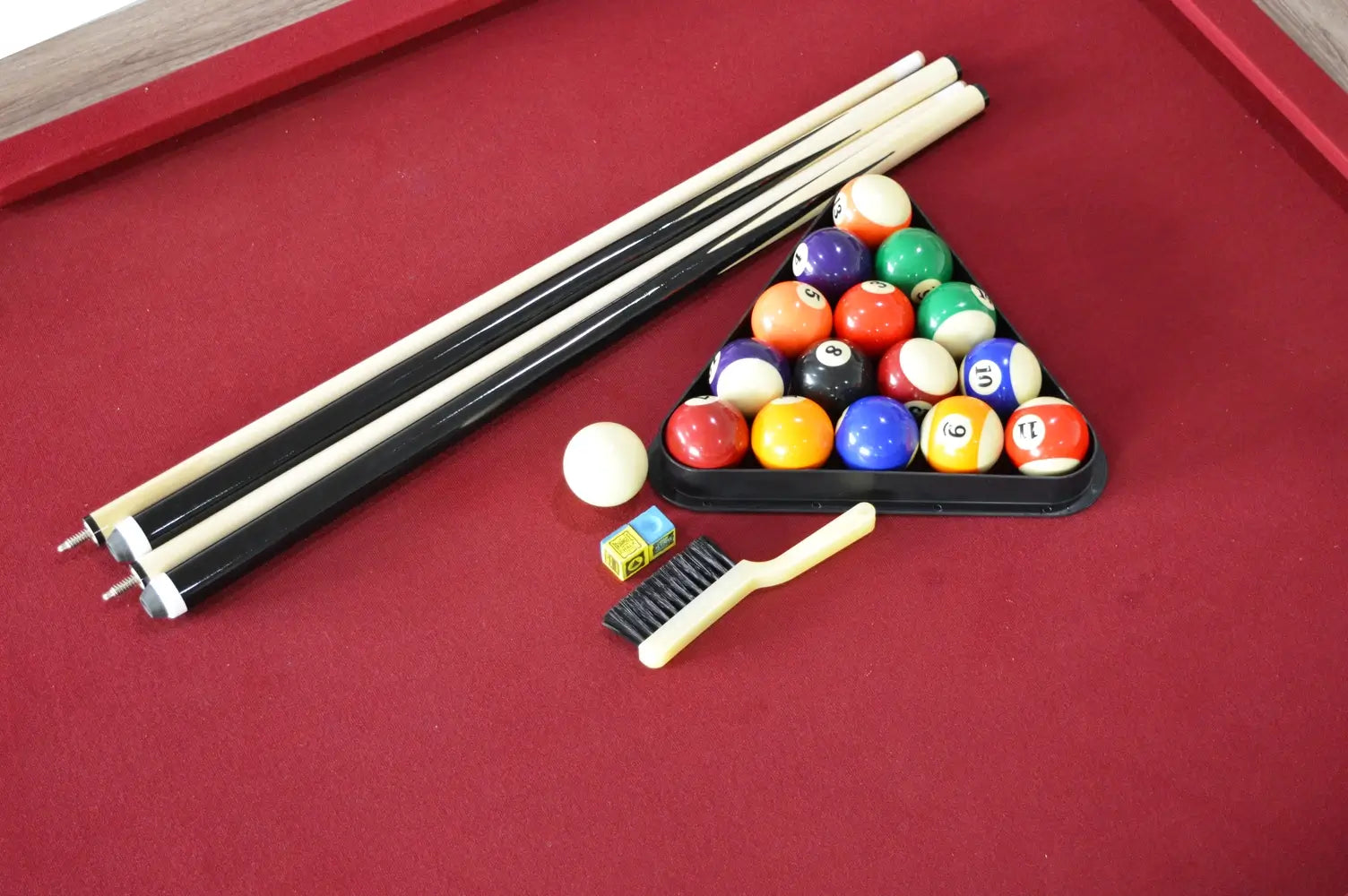 Close-up of the table tennis net and post clamp attached to the driftwood rail of the Hathaway Newport combo table.