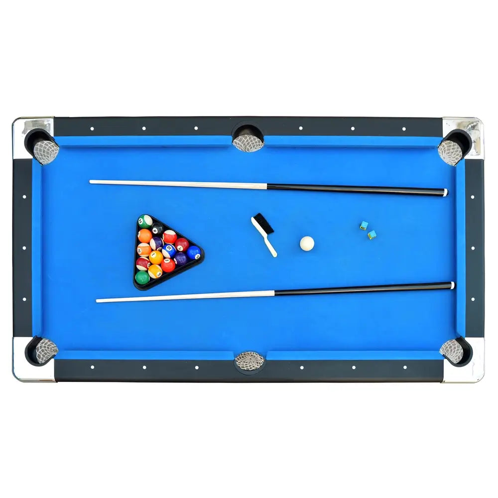 Top-down view of Hathaway Fairmont 6-ft Pool Table setup with cue sticks, balls, brush, and chalk placed on blue felt playfield.