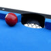Close-up of Hathaway Fairmont 6-ft Pool Table pocket with blue felt surface and mesh drop pocket, showing a red ball near the hole.