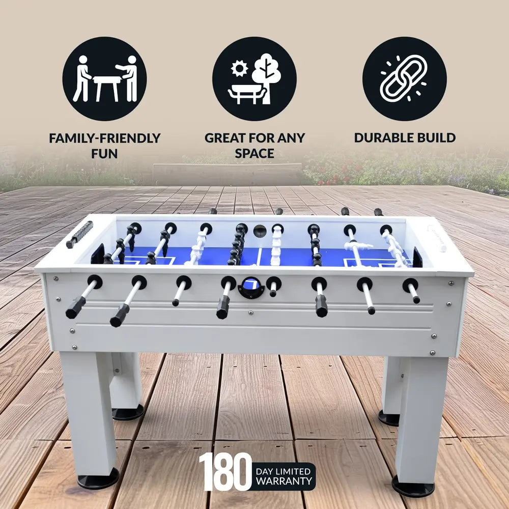 Foosball table placed on patio deck with icons promoting family fun, durability, and space versatility; includes 180-day limited warranty badge.