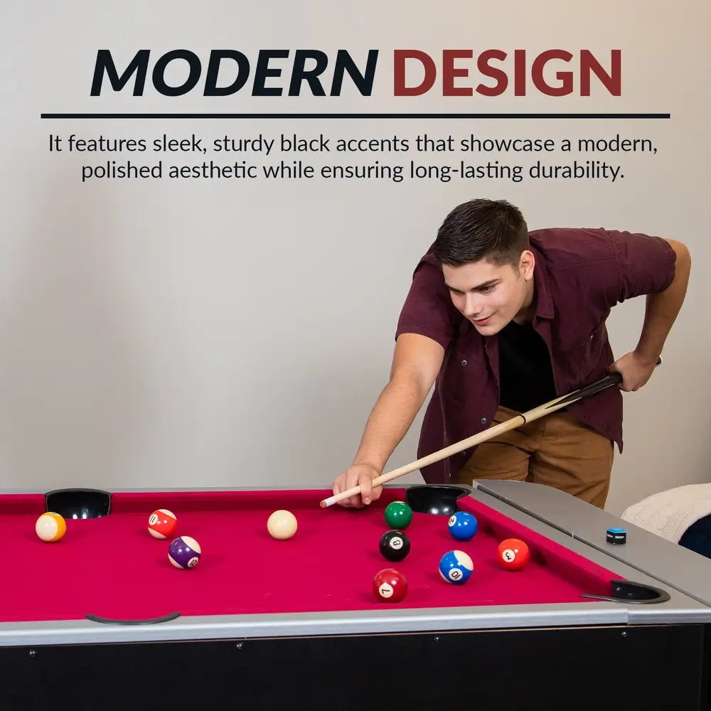 Young man playing pool on red-felt billiards table, part of a 3-in-1 game unit with sleek black trim and modern design, highlighting durability and stylish finish.