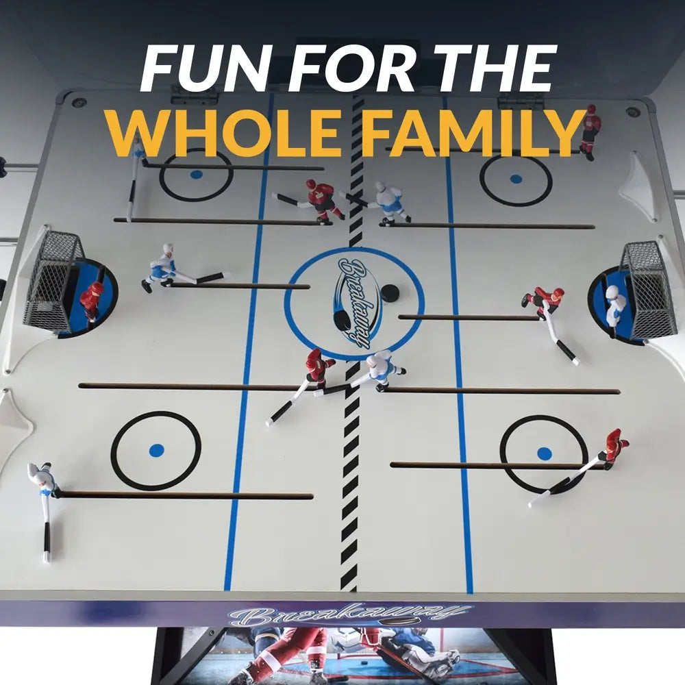 Top-down view of the Breakaway Hockey Table playfield featuring red and blue player figures, rink graphics, two goals, and center ice with 'Breakaway' branding.