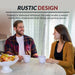 Man and woman enjoying a meal at Hathaway driftwood table, showcasing rustic design with distressed wood grain finish for versatile home decor.
