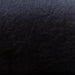 Textured close-up of Hathaway chair’s black faux leather upholstery, designed for comfort, durability, and easy cleaning.