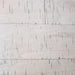 Distressed wood grain close-up of Hathaway driftwood tabletop, emphasizing rustic charm and farmhouse-style aesthetic.