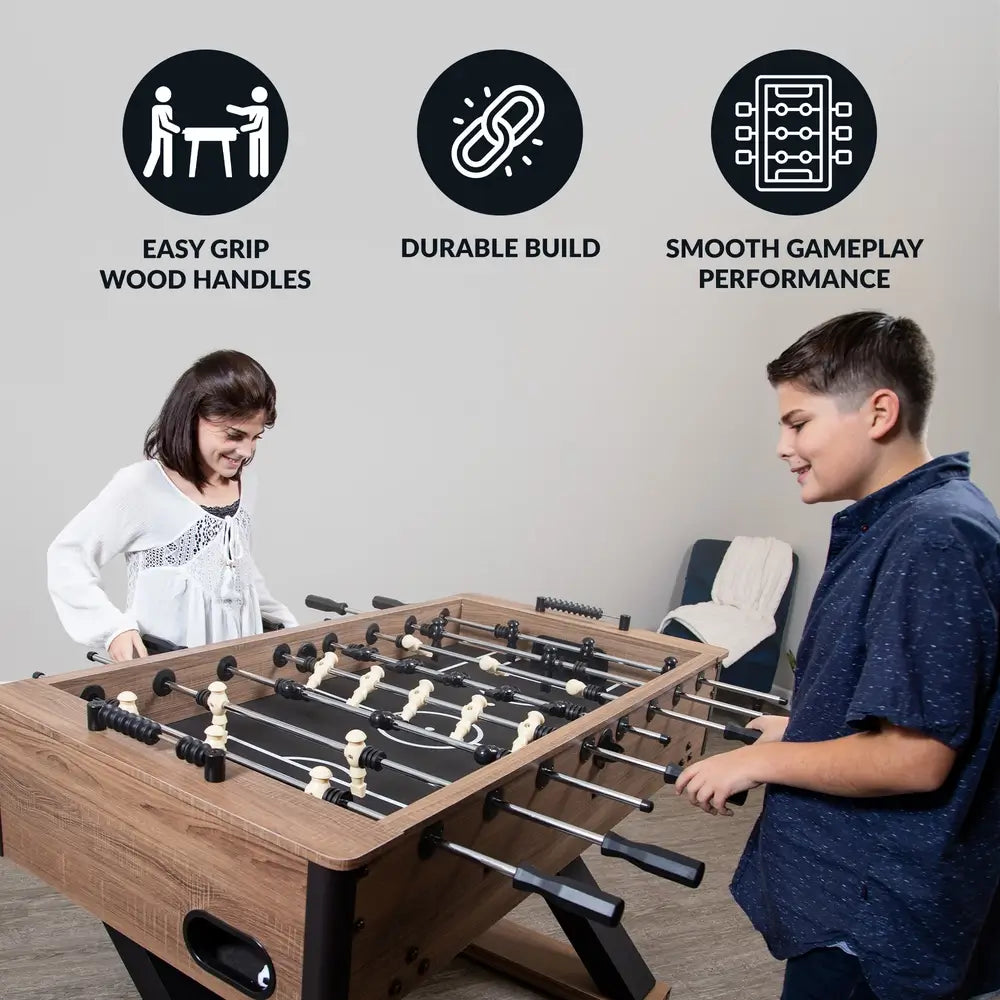 Boy and girl enjoying a game on the Hathaway Excalibur foosball table, highlighting its easy-grip wood handles, durable build, and smooth gameplay performance.