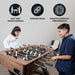 Boy and girl enjoying a game on the Hathaway Excalibur foosball table, highlighting its easy-grip wood handles, durable build, and smooth gameplay performance.