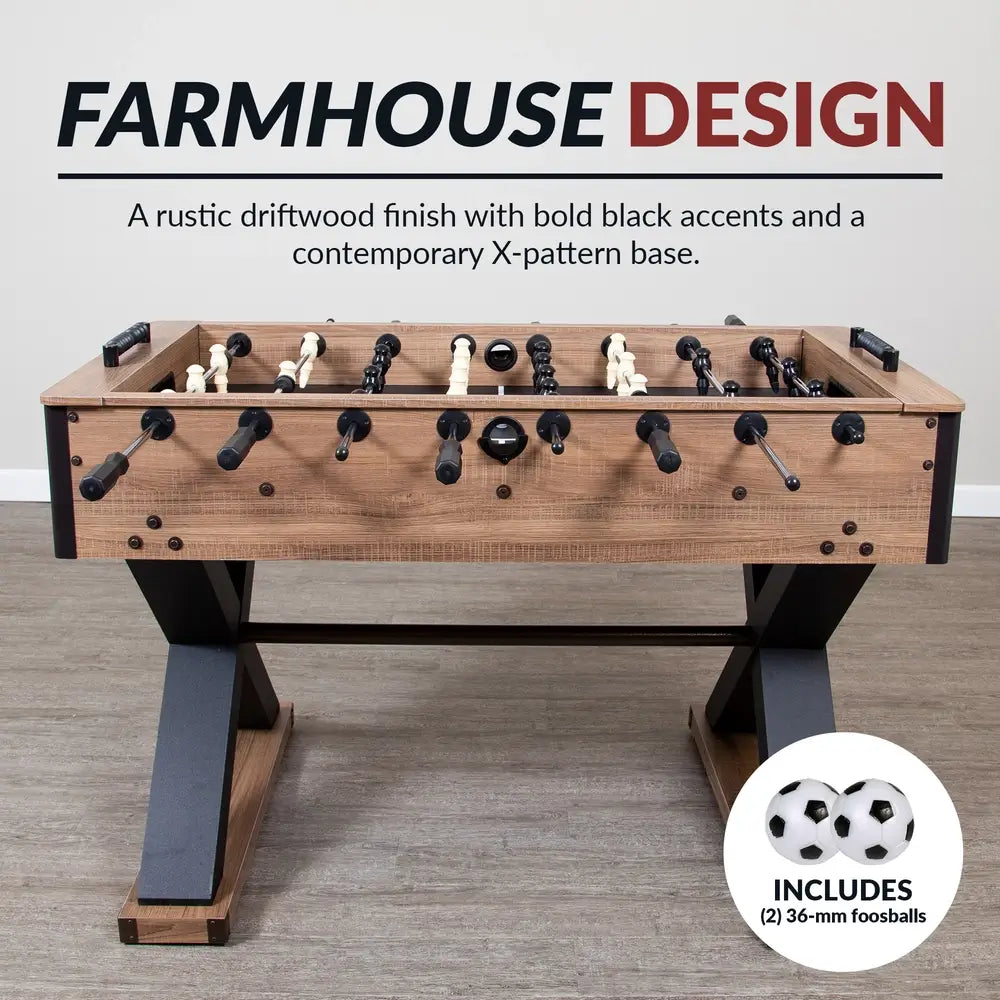Front view of Hathaway Excalibur foosball table with rustic driftwood finish, black player figures, and bold black X-pattern base; includes two 36-mm foosballs shown in the corner.