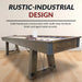 Side view of Hathaway Cheyenne shuffleboard table showing rustic-industrial design with aged metal brackets, multi-step wood finish, and cross-support chains for stability.