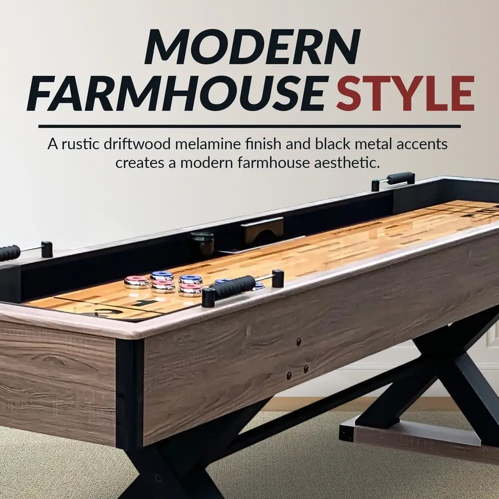 Side angle of the Excalibur shuffleboard table showing its modern farmhouse design with rustic driftwood melamine finish and black metal accents.