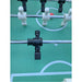 Close-up of black foosball player with defined facial features and textured foot, mounted on chrome rod above soccer field-style surface.