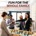 Diverse group of four adults enjoying a foosball match indoors, smiling and celebrating around a light oak foosball table with black and white player figures.