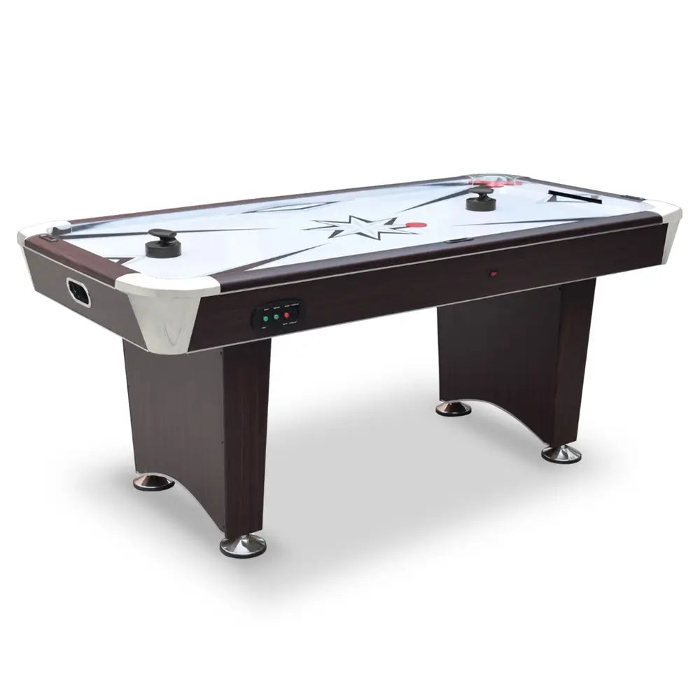 Modern air hockey table with dark cherry wood cabinet and chrome accents, featuring a white playfield with starburst graphics, two black pushers, two red pucks, and electronic controls on the side panel. Sturdy pedestal-style legs with chrome leg levelers enhance balance and stability.