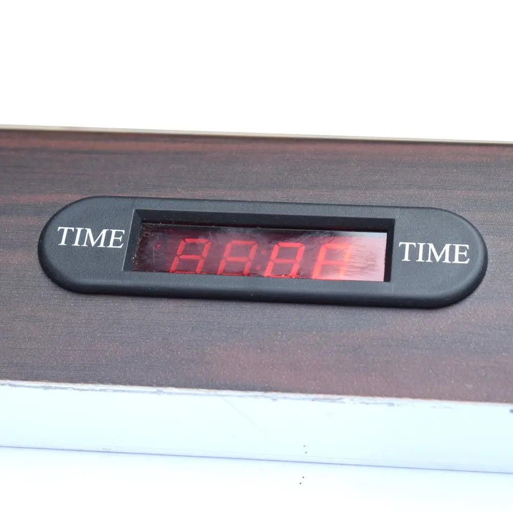 Digital LED time display on the air hockey table, embedded in the dark wood trim. The red screen displays countdown or game duration with "TIME" labeled on both sides of the display window.