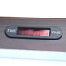 Digital LED time display on the air hockey table, embedded in the dark wood trim. The red screen displays countdown or game duration with "TIME" labeled on both sides of the display window.