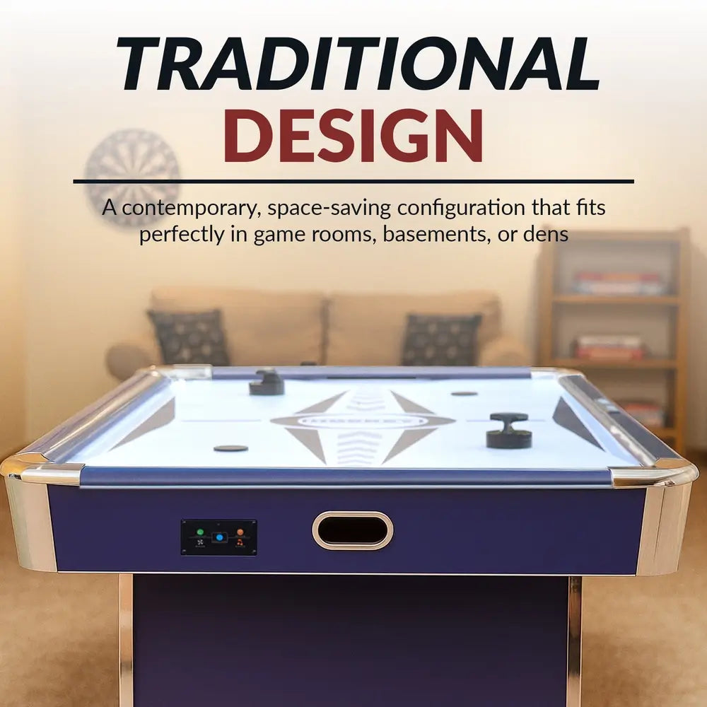 Front-facing view of Hathaway Phantom II air hockey table in blue, with chrome accents, white graphic playfield, and a contemporary design. Shown in a cozy game room with couch and bookshelf, emphasizing space-saving traditional design.