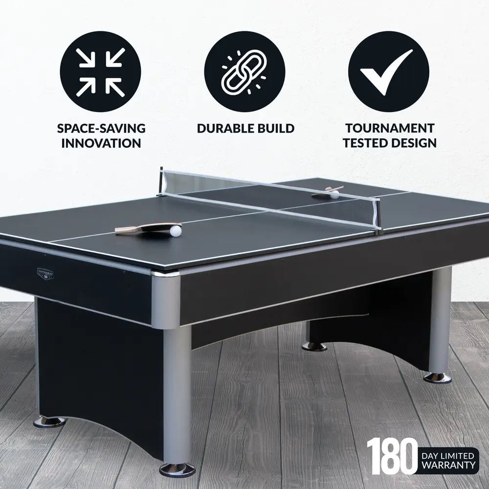 Hathaway game table in table tennis mode on wood flooring, with feature icons emphasizing space-saving design, durable build, and tournament-tested quality, plus 180-day warranty.