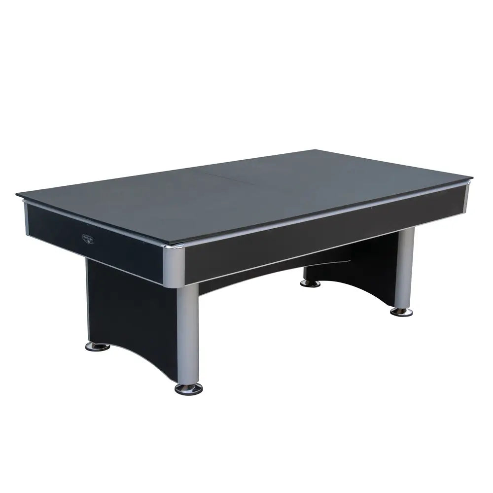 Convertible game table in flat closed position with black table tennis top installed, displaying sleek black and gray body with chrome corner caps.