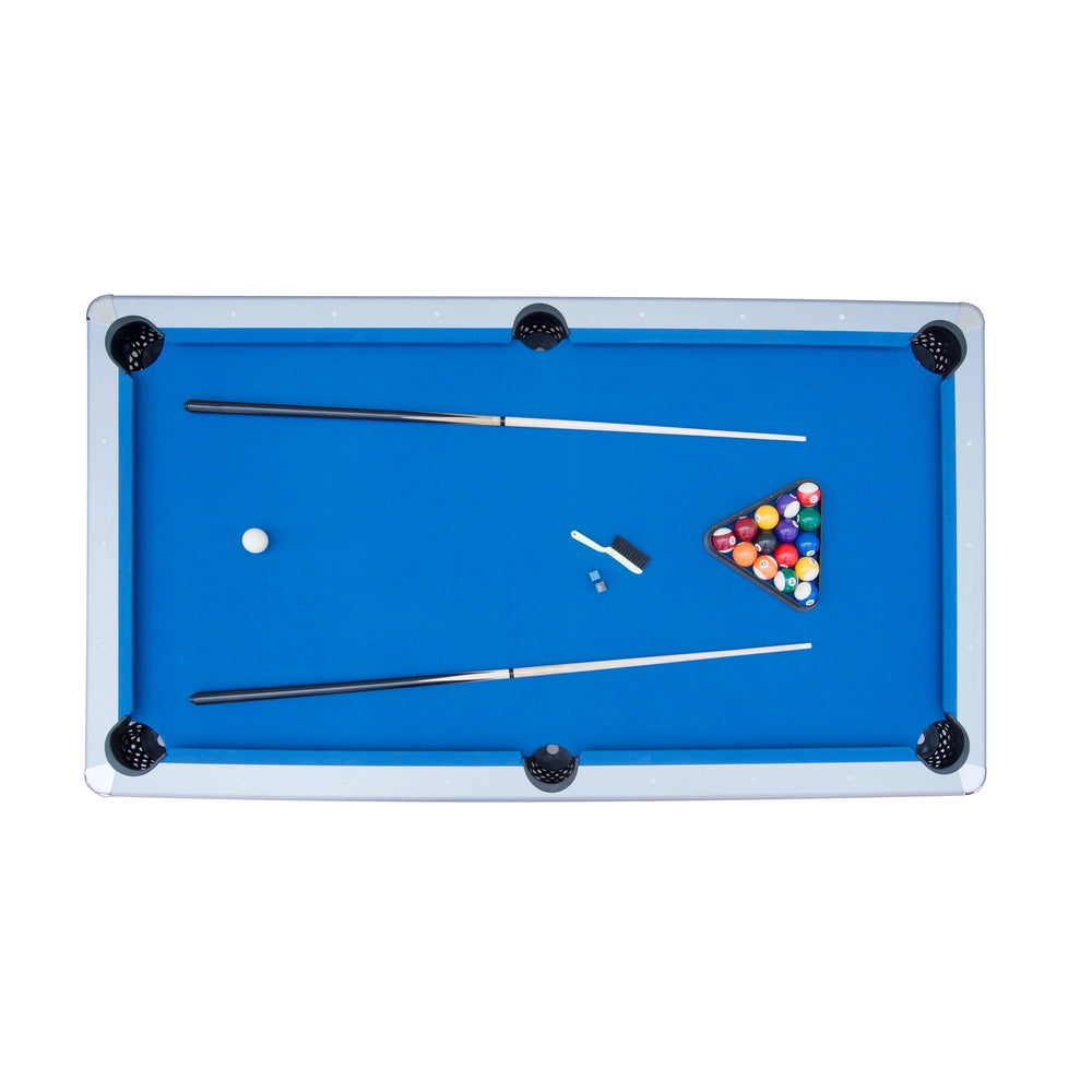 Top-down view of Hathaway pool table with racked billiard balls, two cue sticks, a cue chalk, and a table brush on vibrant blue felt surface with six drop pockets.