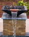 Black Travertine TessaRai Square Fire/Water Bowl Kit with copper spillway and waterfall mounted on stone pool column