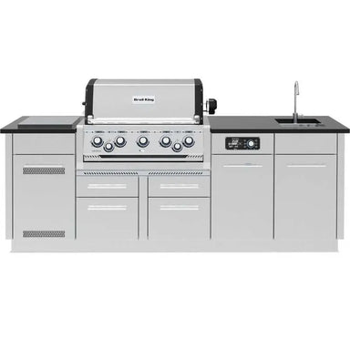 Frontal view of the Broil King Imperial QS 590iH 10-foot outdoor kitchen island with black countertop and 5-burner grill.