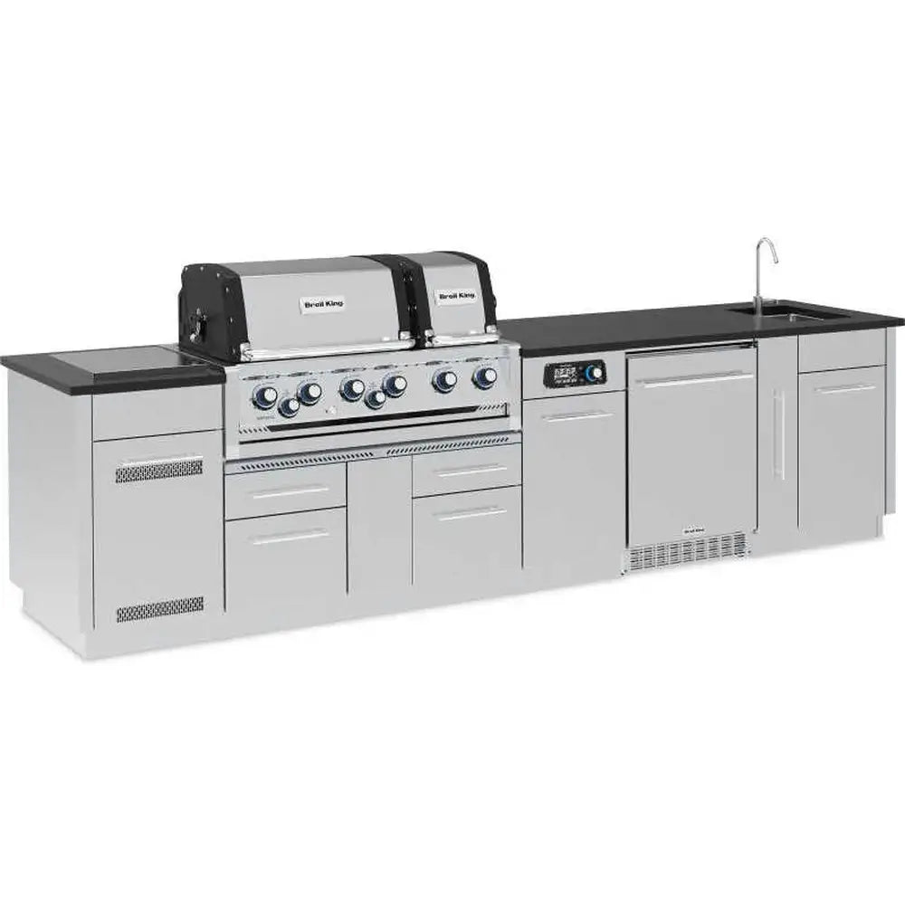 Left-side perspective of the Broil King Imperial QS 690iH grill island showcasing the S-690i smart grill and side burner configuration.