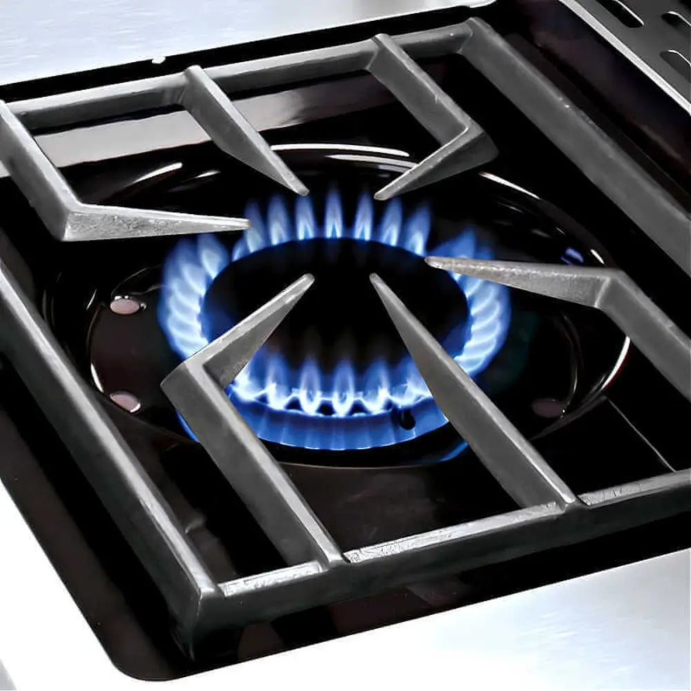 Close-up of a high-output professional gas side burner with blue flames on a Broil King Imperial series outdoor kitchen.