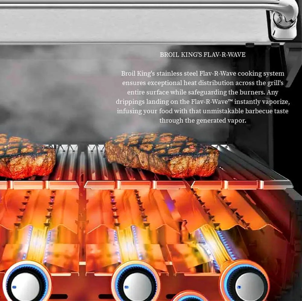 Close-up of Broil King Flav-R-Wave stainless steel cooking system with burners and steaks on the grill grates for even heat distribution.