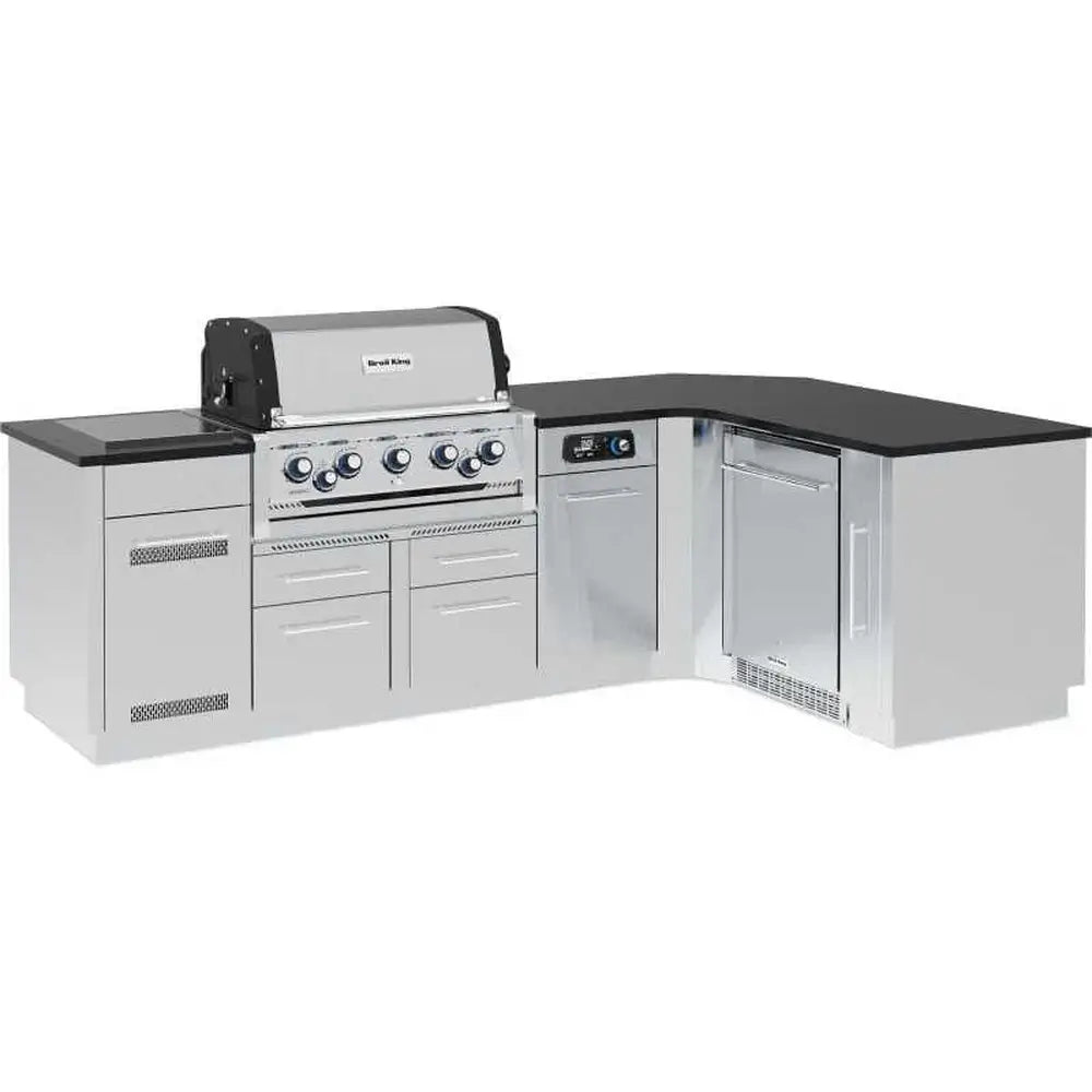 Assembled Broil King Imperial QS 590iG L-shaped stainless steel outdoor kitchen island featuring a built-in smart grill and integrated side burner.